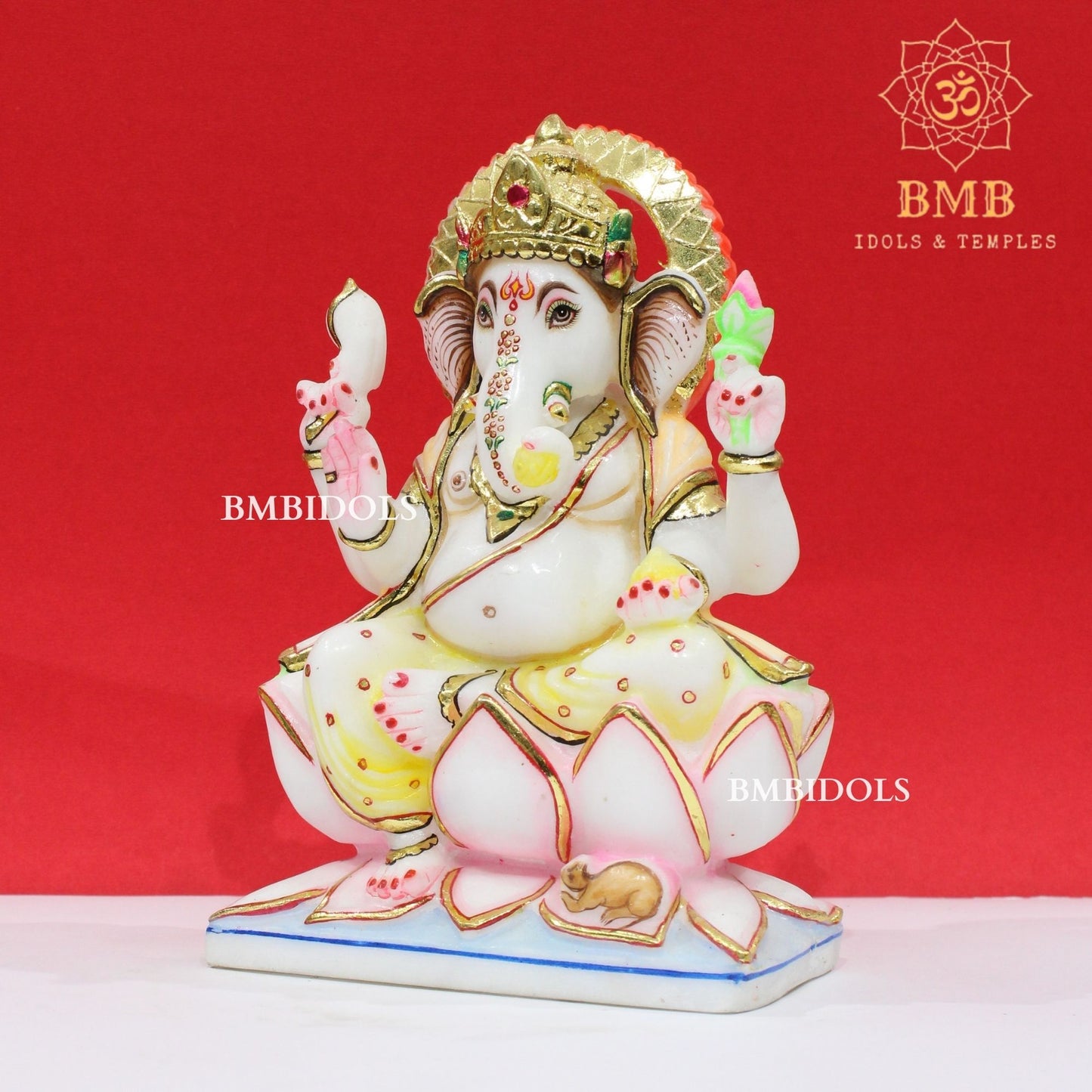 Marble Ganesha Murti sitting on the Lotus with Four Hands