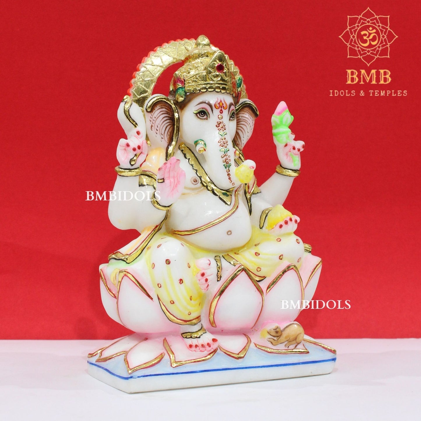 Marble Ganesha Murti sitting on the Lotus with Four Hands