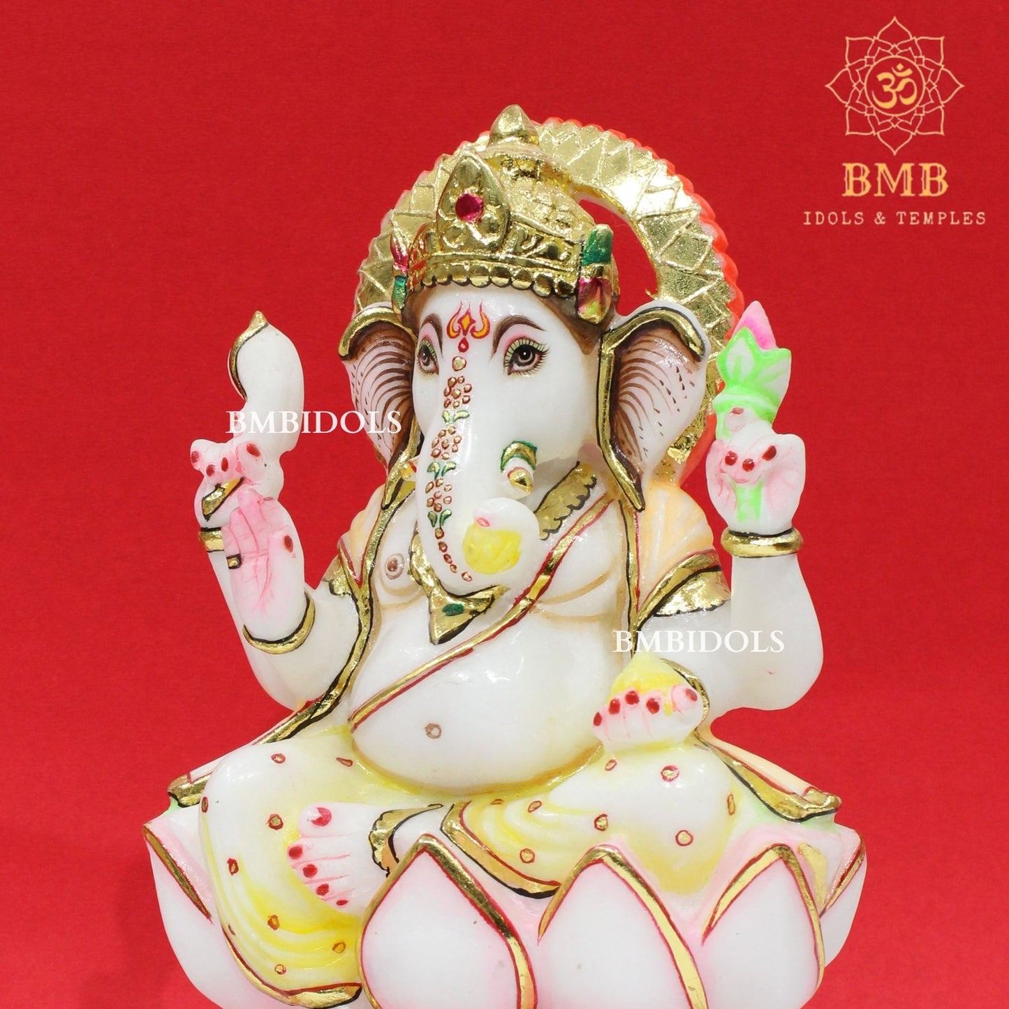 Marble Ganesha Murti sitting on the Lotus with Four Hands
