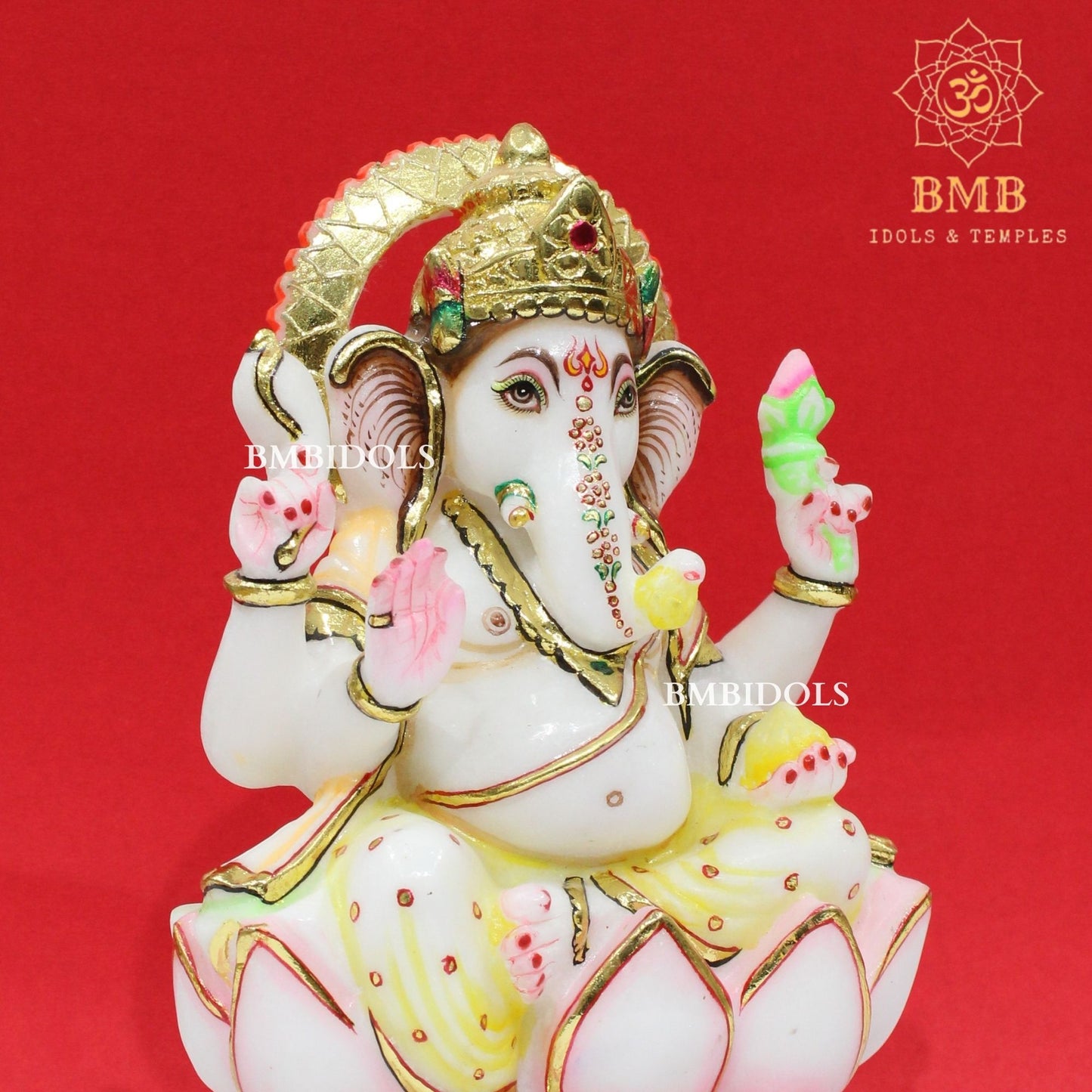 Marble Ganesha Murti sitting on the Lotus with Four Hands
